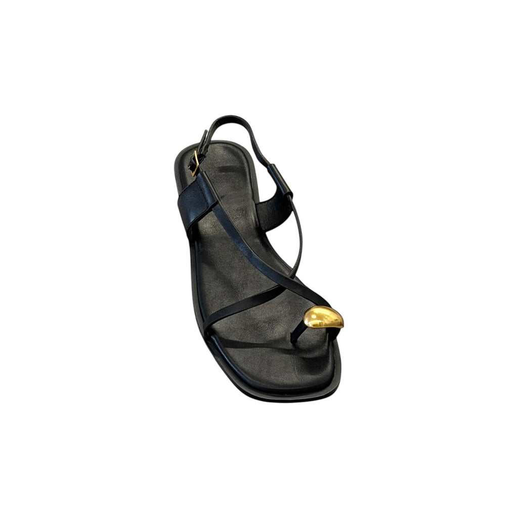 JESSICA black leather flat sandals with a gold toe ring detail and adjustable ankle strap. Perfect for summer.