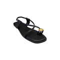 JESSICA black leather flat sandals with a gold ring detail on the toe strap and adjustable ankle buckle.