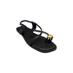 JESSICA black leather flat sandals with a gold ring detail on the toe strap and adjustable ankle buckle.