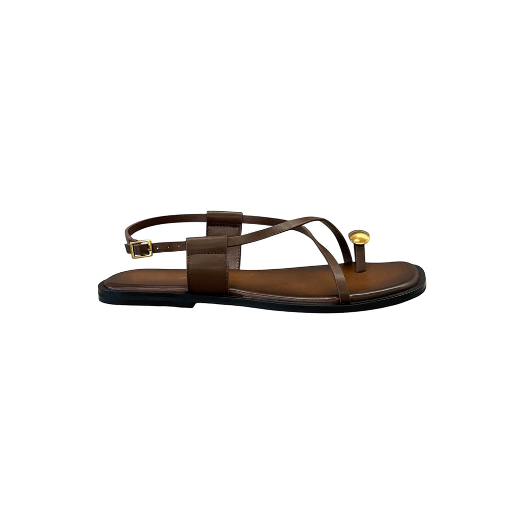 JESSICA brown leather flat sandals with a gold ring detail on the toe strap and ankle buckle closure.